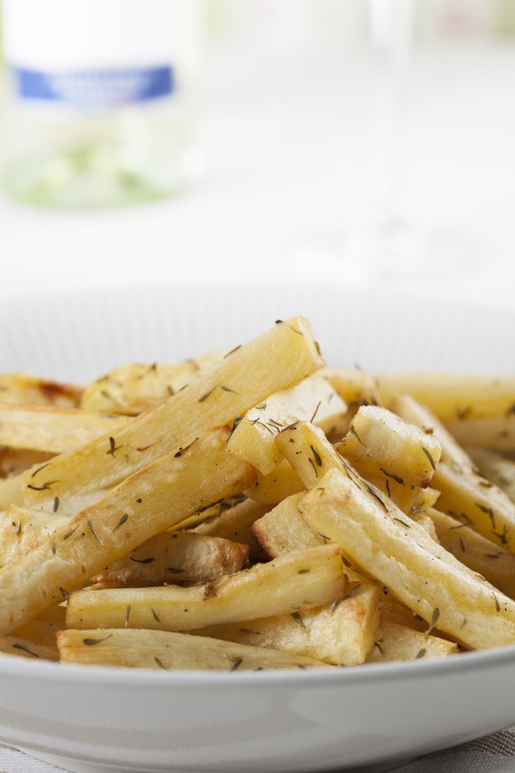 Cut roasted parsnips or potatoes with herbs.