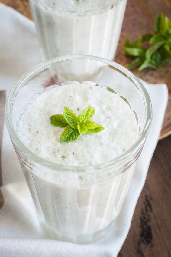 Salted Mint Lassi a popular yogurt drink throughout India made with mint and ginger top down view
